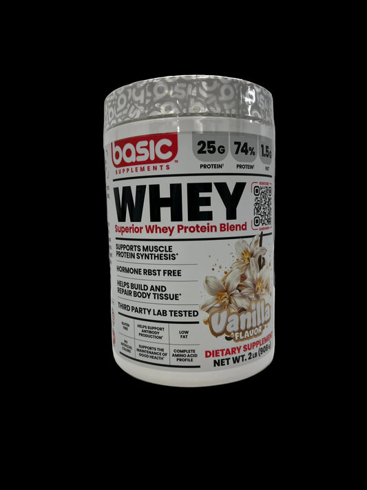 A tub of Basic Nutrition Whey Protein powder, specifically the Clear variant, shown lying horizontally on a white surface.